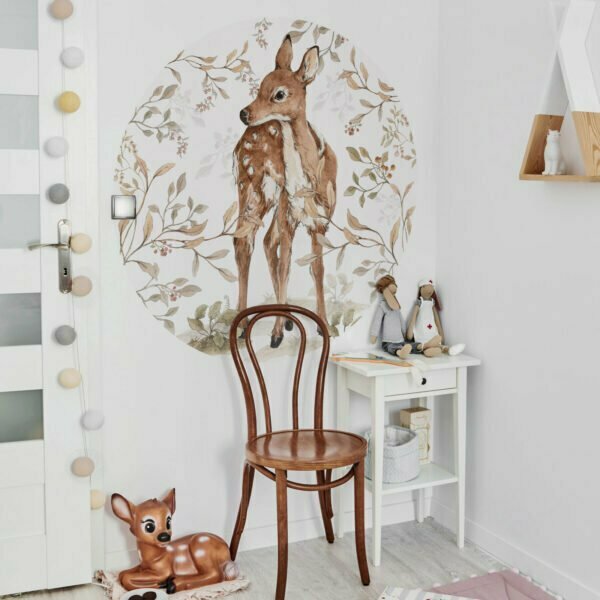 baby / kids room with round wall sticker with a ree looking to the left surrounded by twigs