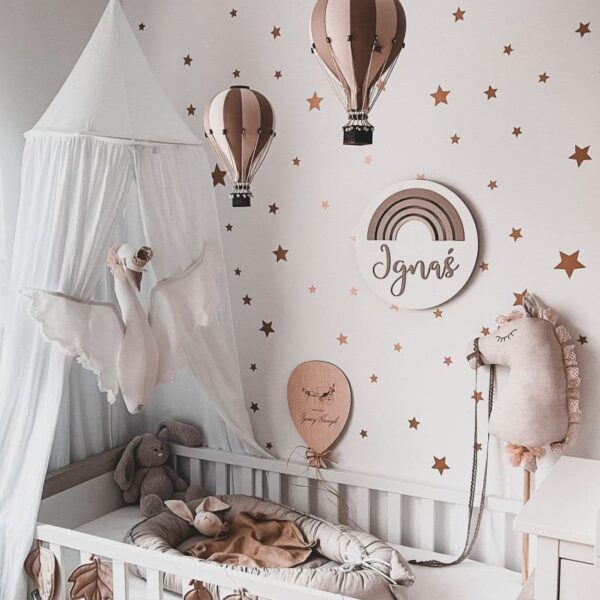 Children's room with many gold stars on the wall, which are wall stickers