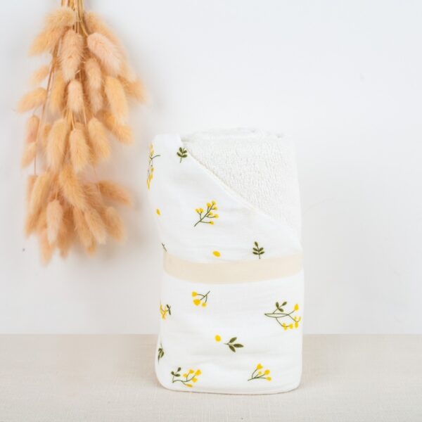 Organic cotton baby hooded towel with yellow floral motif
